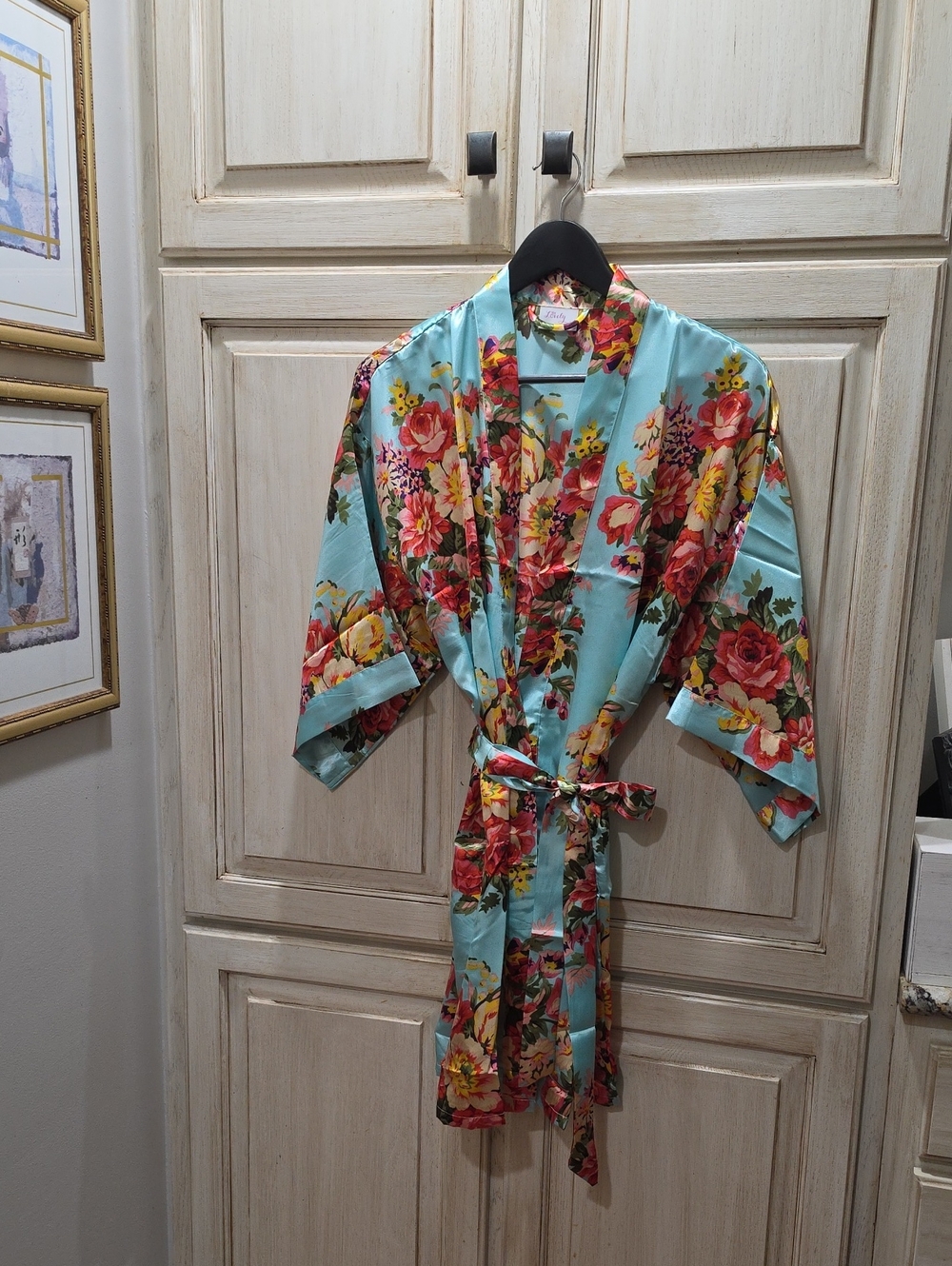 Ms Lovely short kimono robe features a silky aqua blue fabric pattern M/L